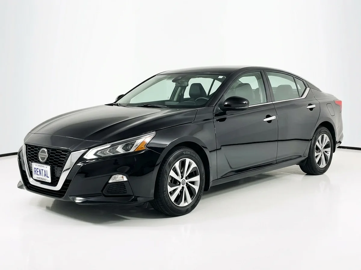 Nissan Altima full-size sedan, black, three-quarter front view, professional car rental fleet photography on white background